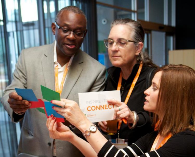 bushCON attendees examine their randomly assigned session tickets and contemplate a trade. (Photo: RJL Photography)