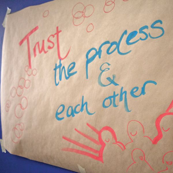 Hand-written sign that says trust the process
